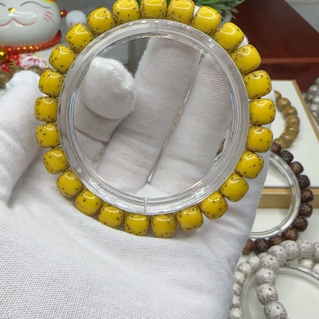 若***处星月菩提手串鸡油黄半臂留白9×8一朵果