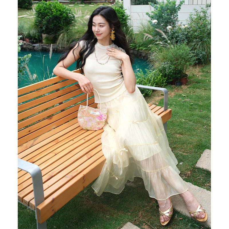 《芒果冰》彼得潘大叔时尚无袖修身薄款针织上衣弹力腰蝴蝶结装饰裙