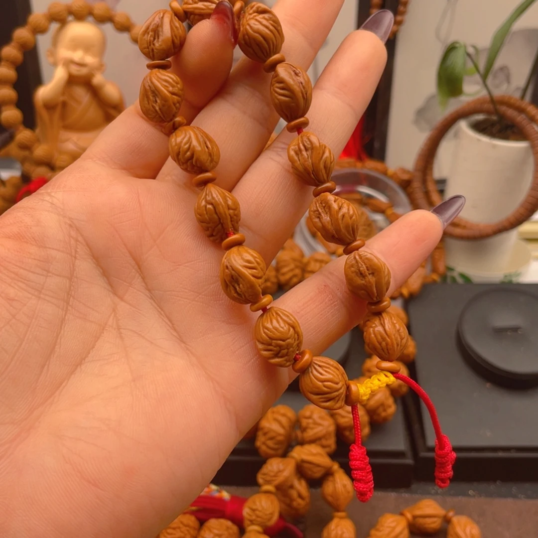 锦***铧桃核手串红红火火。红红火火