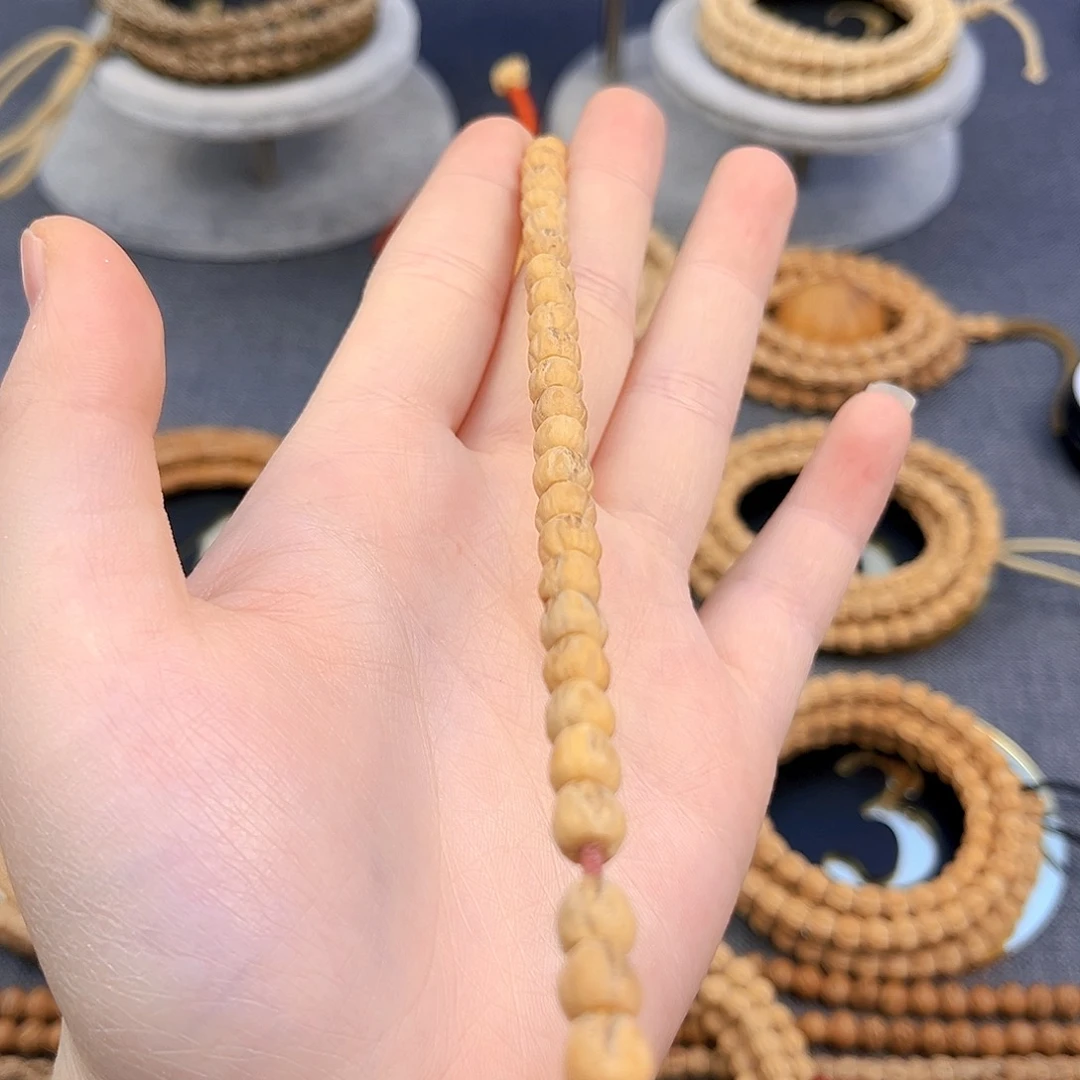 亲***孩柏香籽/百香籽吊坠