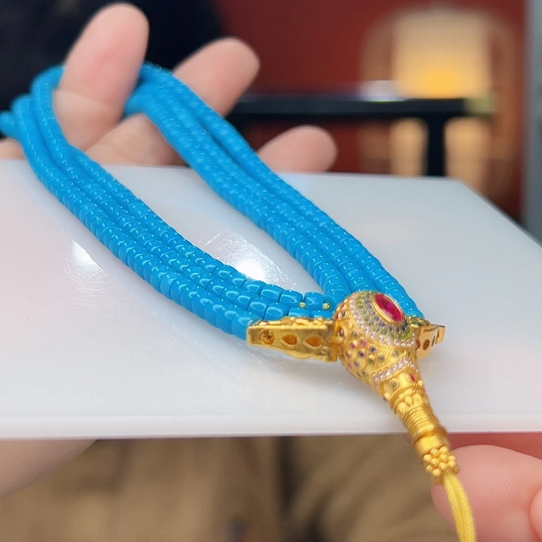 何***为绿松石18K金镶嵌珠宝奇石