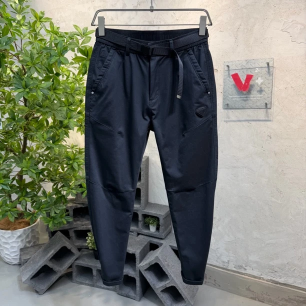 秋冬季高端轻奢定织面料潮流修身小脚休闲裤男松紧弹力腰黑色裤子