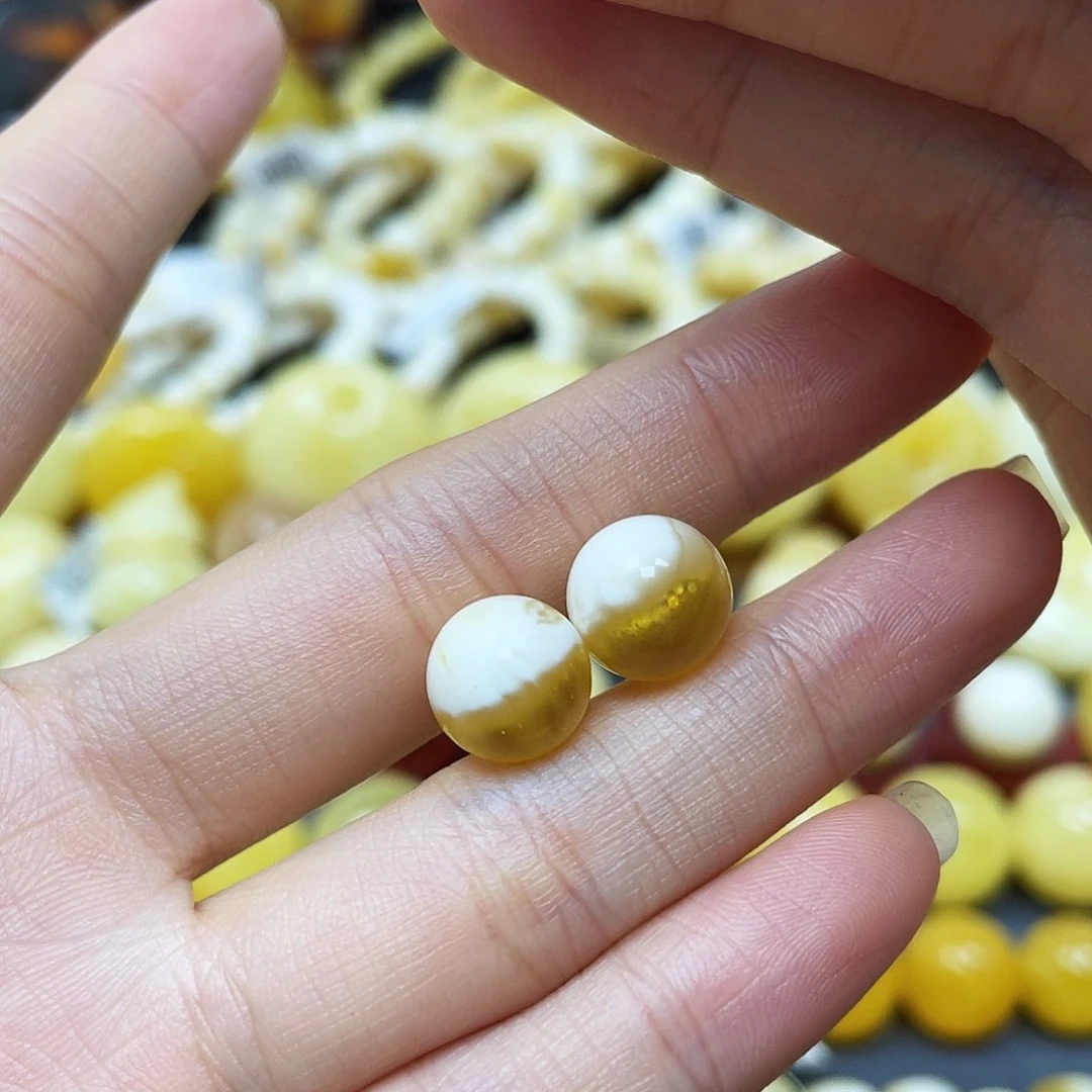 姝***琪未镶嵌蜜蜡裸石圆珠对珠10.2mm瑕