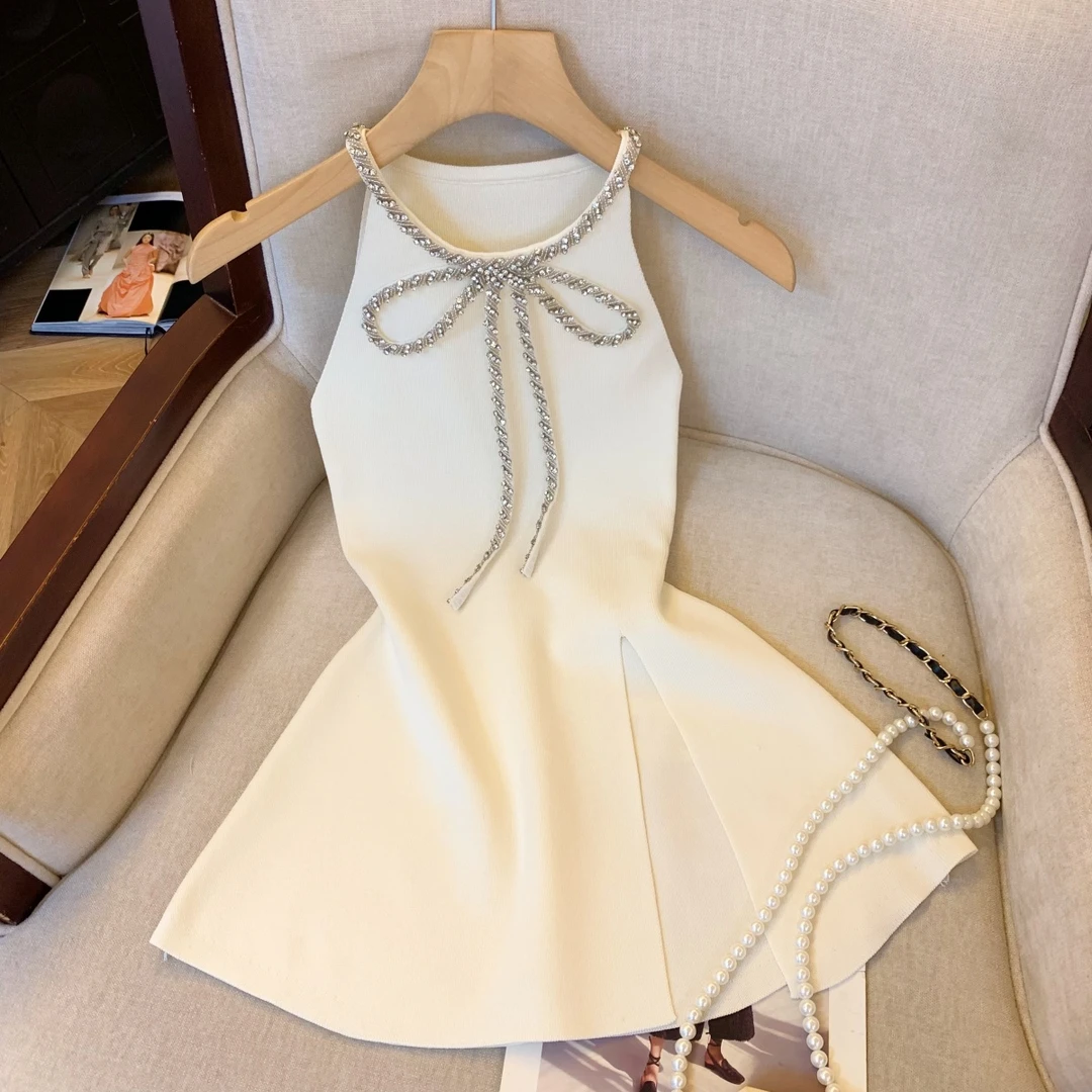 专柜撤回剪标镶钻蝴蝶结吊带背心女夏季新款独特漂亮开叉超仙上衣