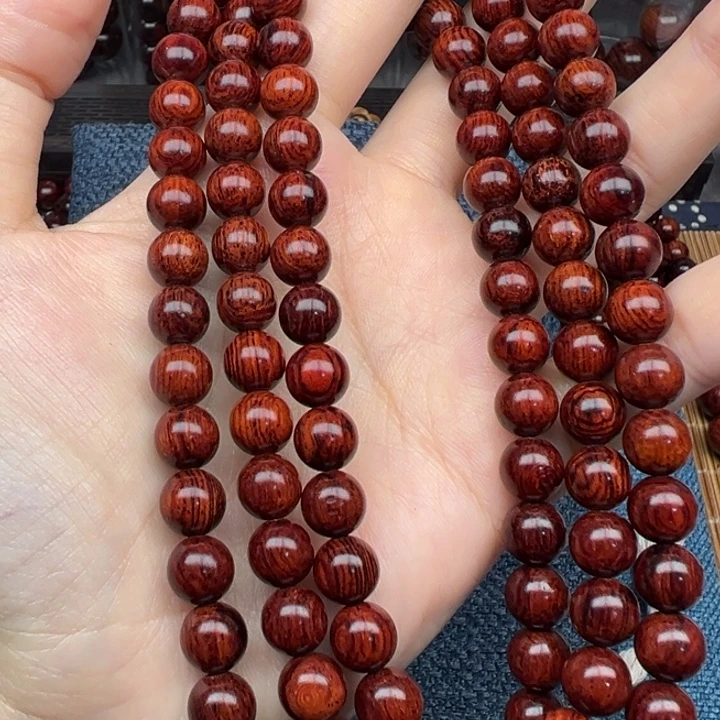 朋***藤类海南红降黄底芝麻点08圆珠108颗（瑕疵）