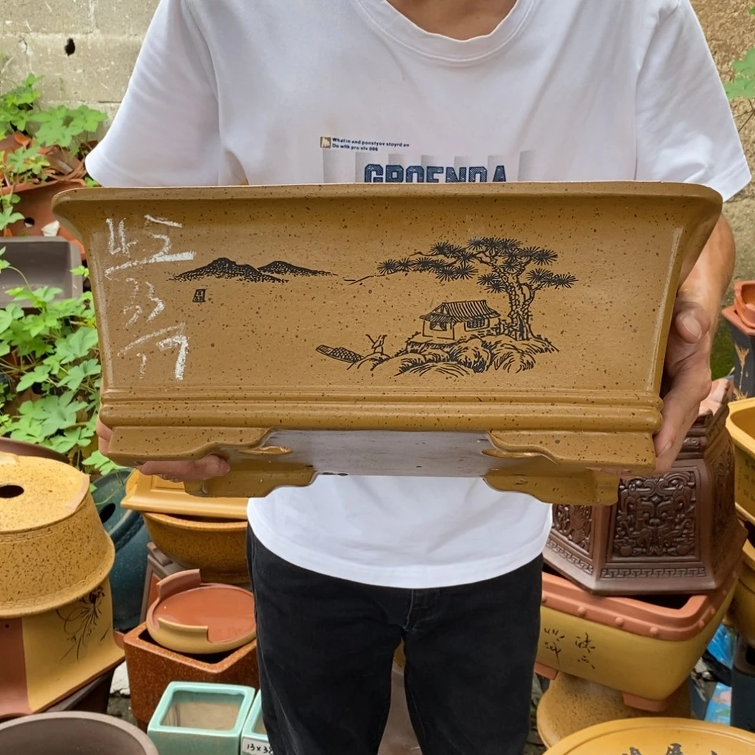 紫砂，紫砂器。我也不