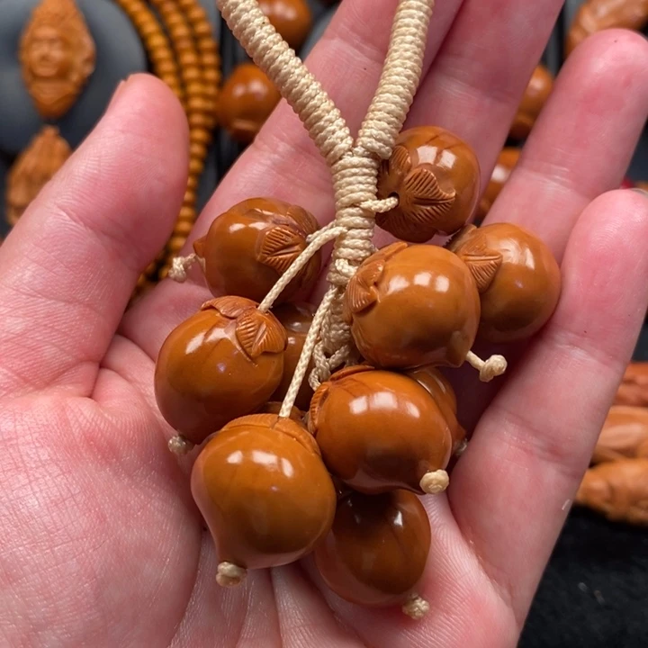 橄榄核手串桃子手把件