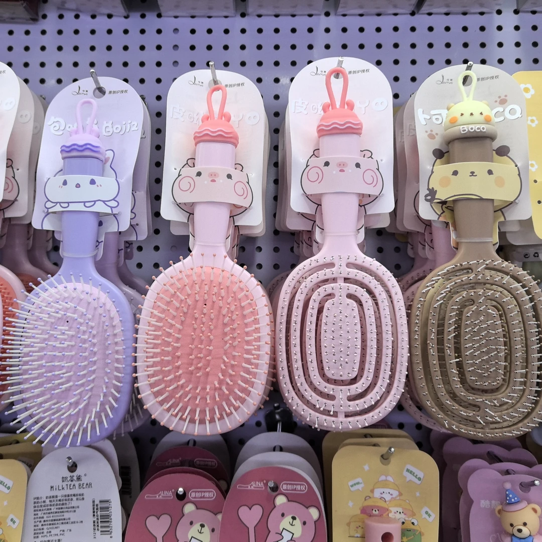 新疆现货包邮按摩梳高弹蓬松柔顺不打结多功能按摩梳子家用干湿