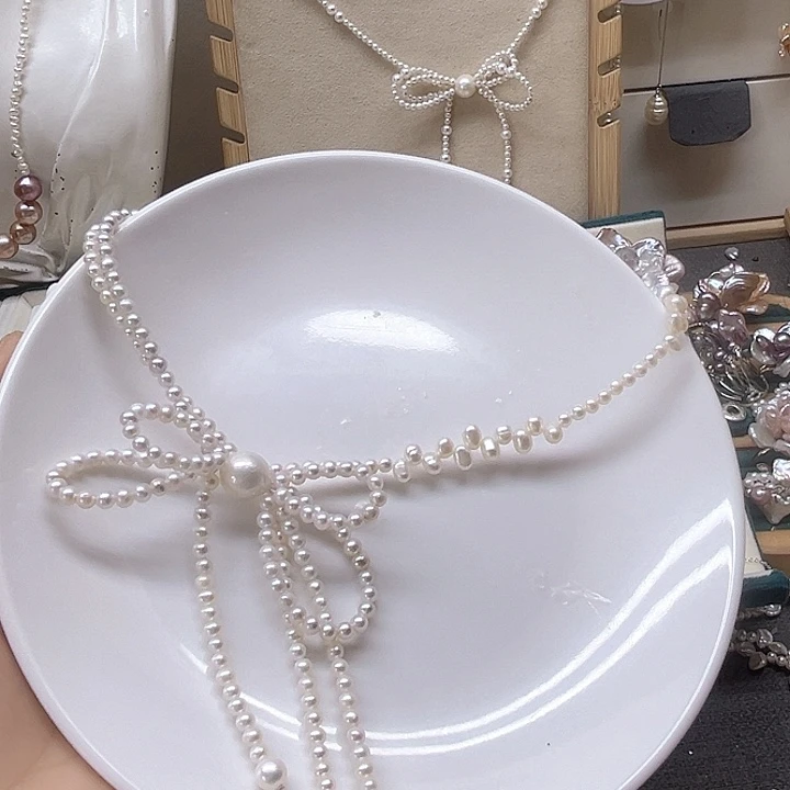 铜***迪三醋酯纤维蝴蝶结项链珍珠项链