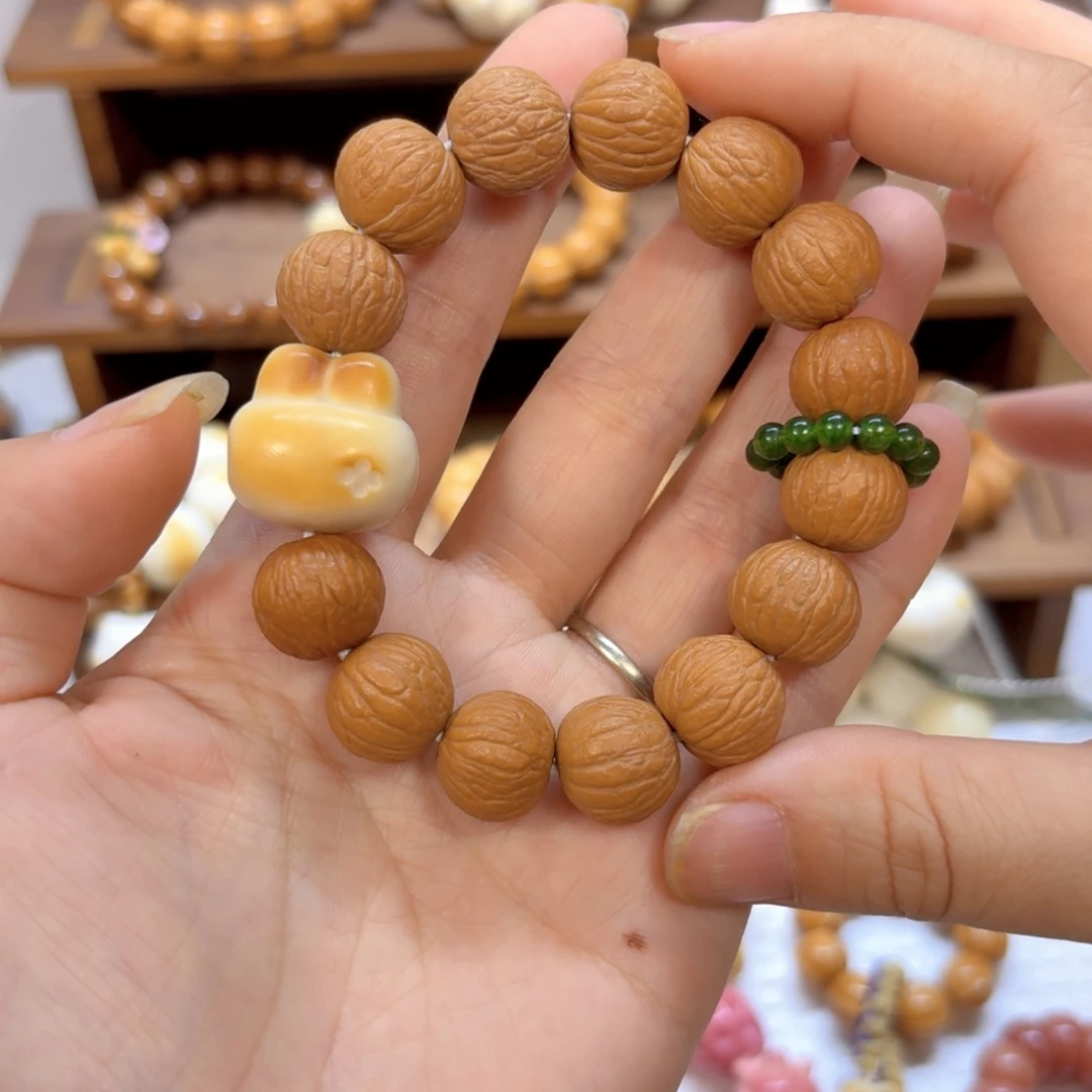 星月菩提吊坠全品猴头风羽象牙果兔兔