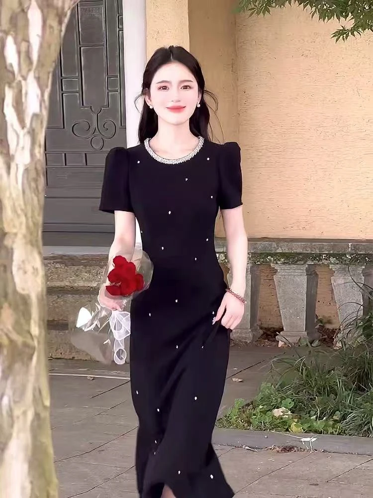 赫本风黑色波点连衣裙女2025夏季新款高级感圆领重工镶钻短袖长裙