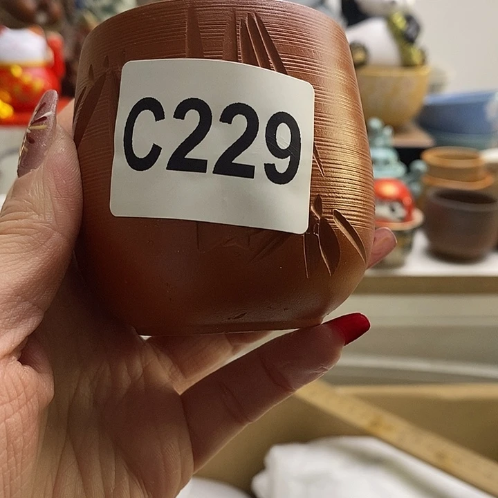 紫砂茶杯慵***虾我们的目标是成为一个优秀的人