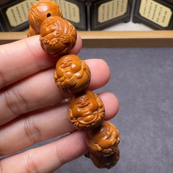 蔡****橄榄核手串/手链短圆光背小弥勒