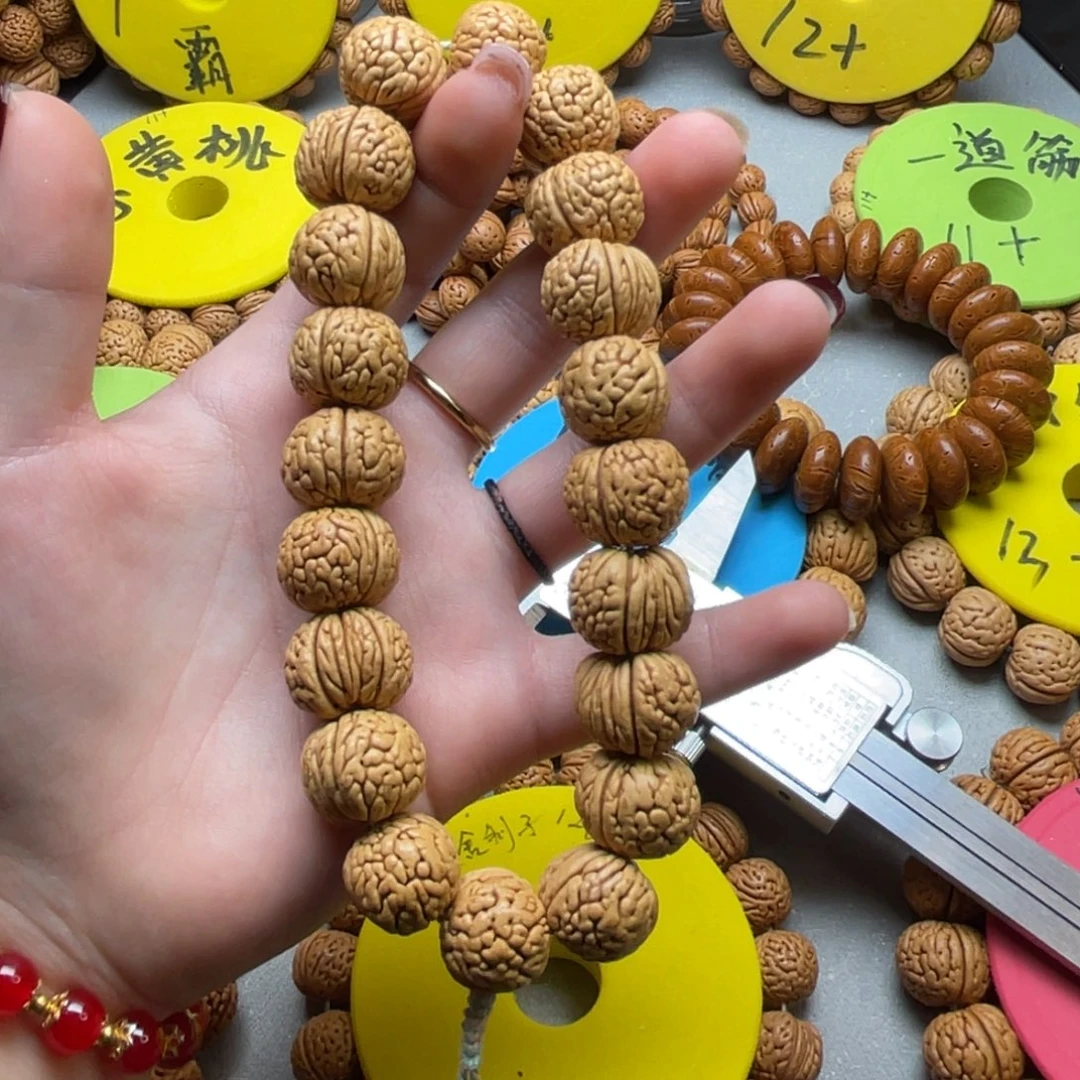 桃核手串流苏铁扇