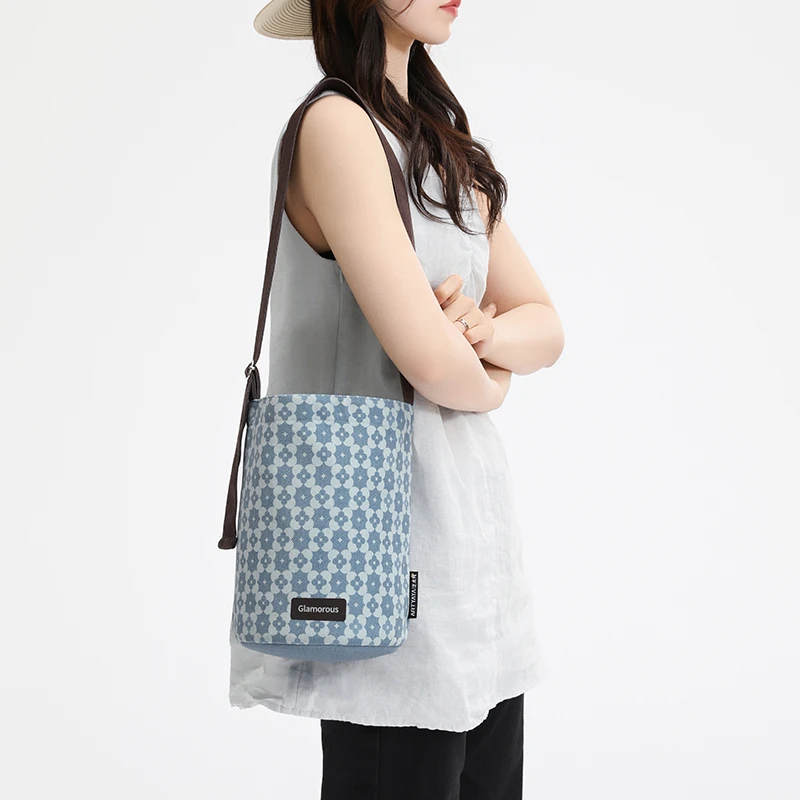 尼睿插画师原创牛仔花花飘带多用水桶包单肩女百搭手提小众通勤包