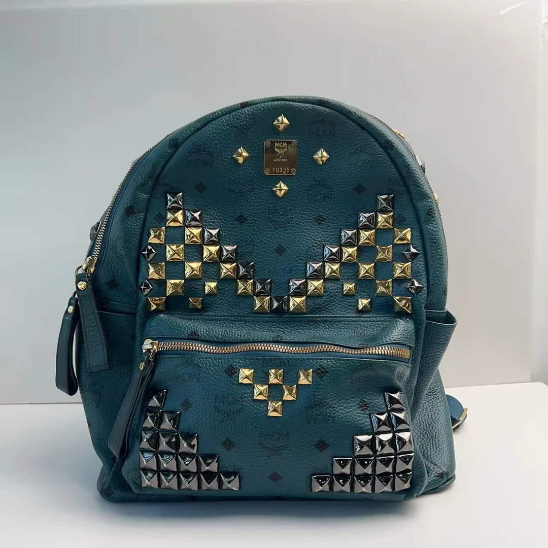 95新 MCM mcm湖蓝色大号铆钉双肩包