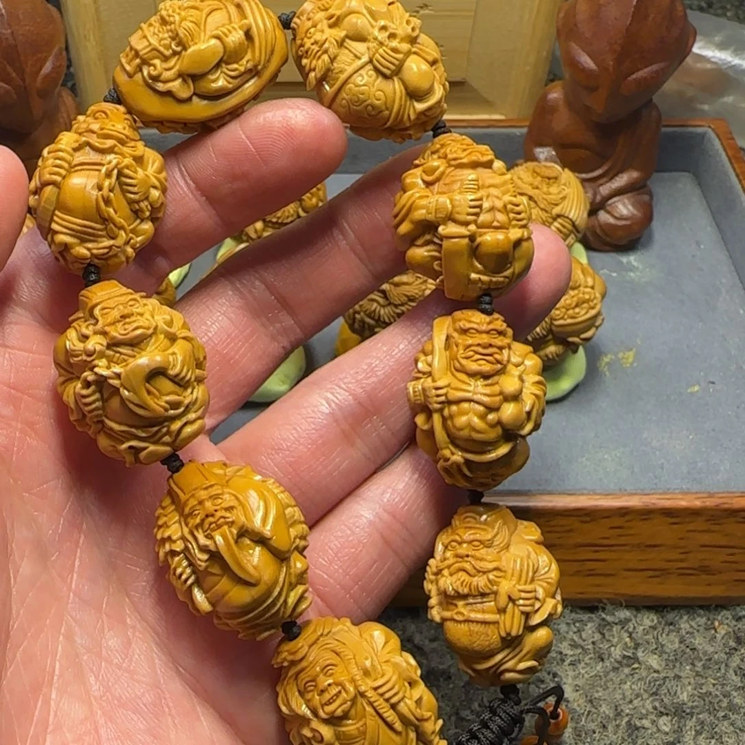 橄榄核吊坠招米地府