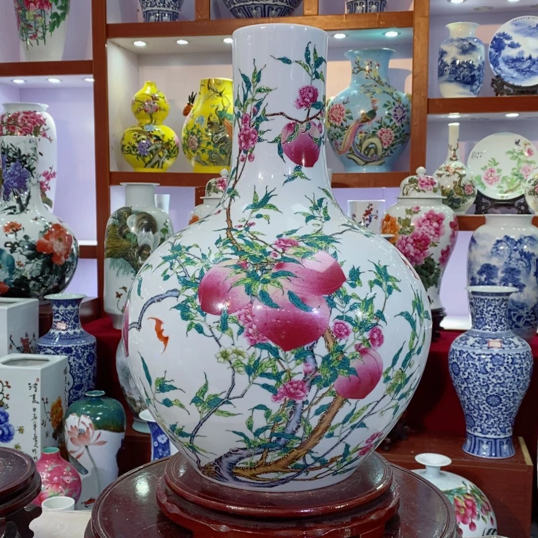 瓷片粉彩九桃天球瓶