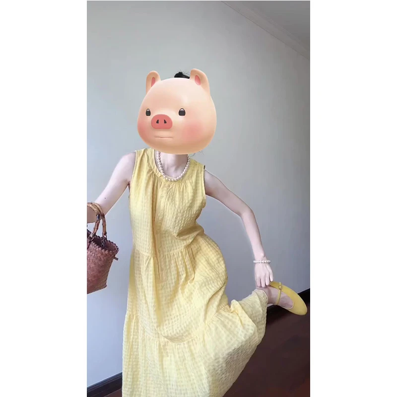 法式黄色无袖背心连衣裙女夏季新款设计感宽松海边度假沙滩长裙子