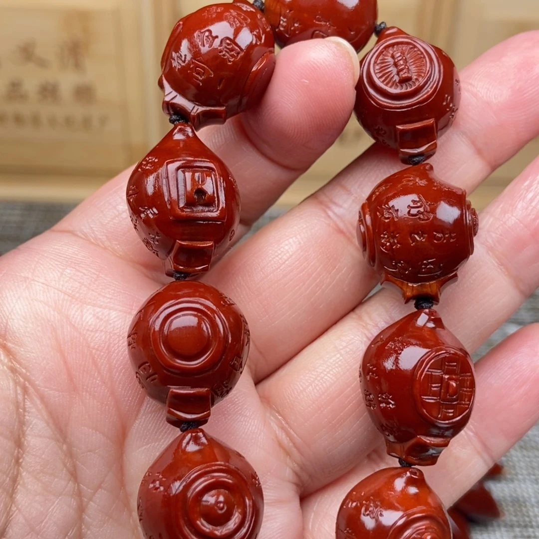 诚***下橄榄核吊坠八把壶