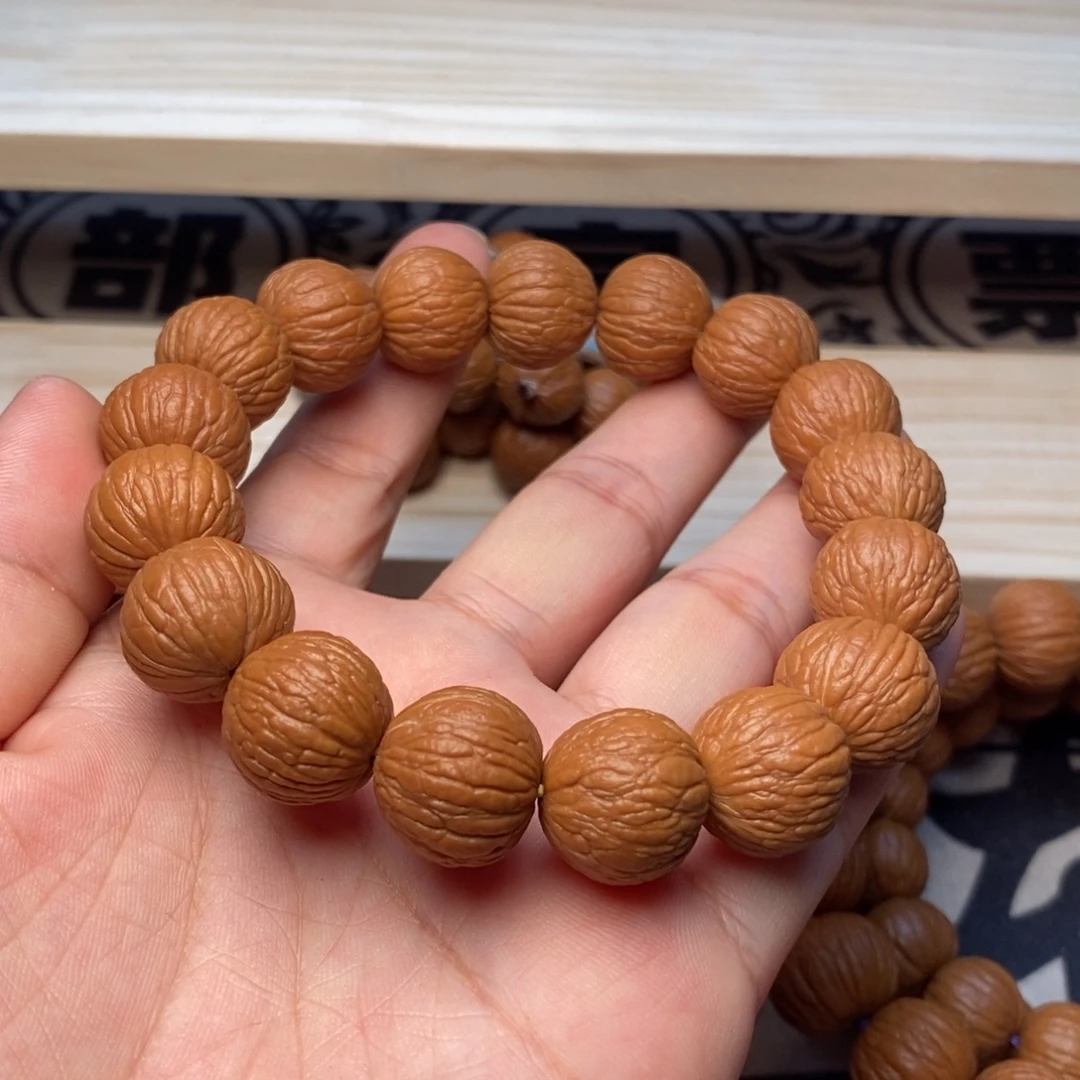 桃核吊坠凤羽打底