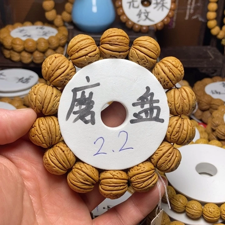 桃核手串人***客老树磨盘大