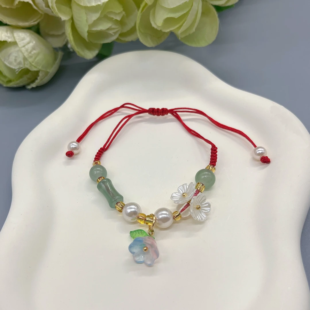 钛钢布艺手链 3289红绳抽拉绿色竹节铃兰手链