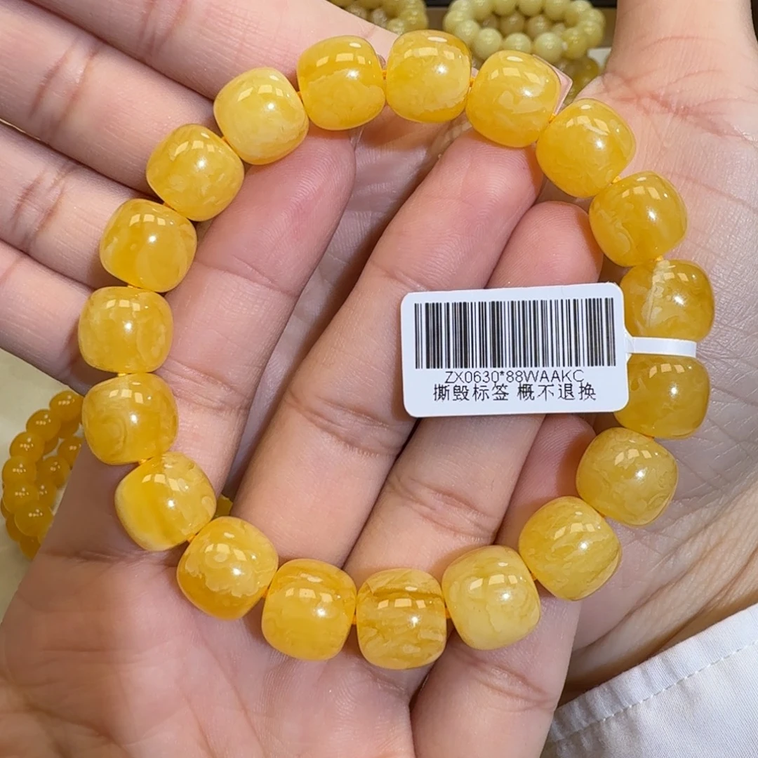 琥珀未镶嵌珠宝奇石11.8焦皮同料橘黄花蜡手串18.9