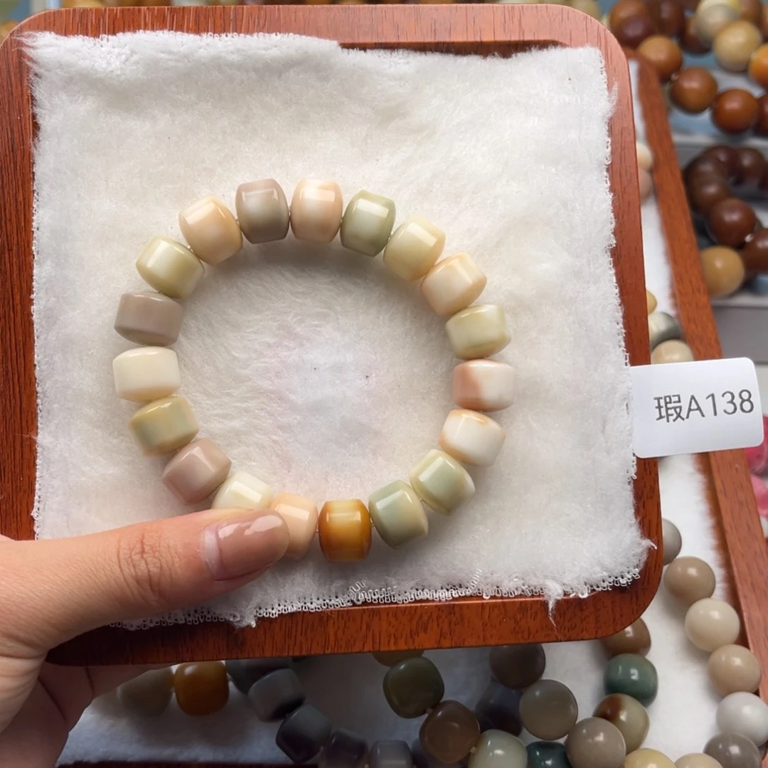 菩提根/象牙果手串梧*12mm金轮一串瑕A138