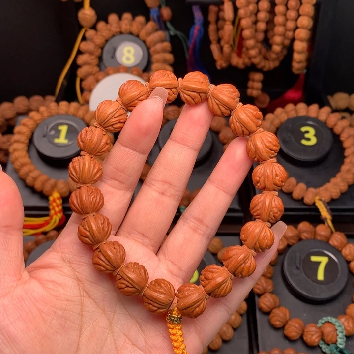 桃核吊坠取***易1.4野生火麒麟手串