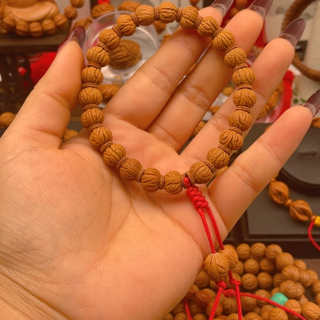 三***夫桃核手串红红火火。红红火火