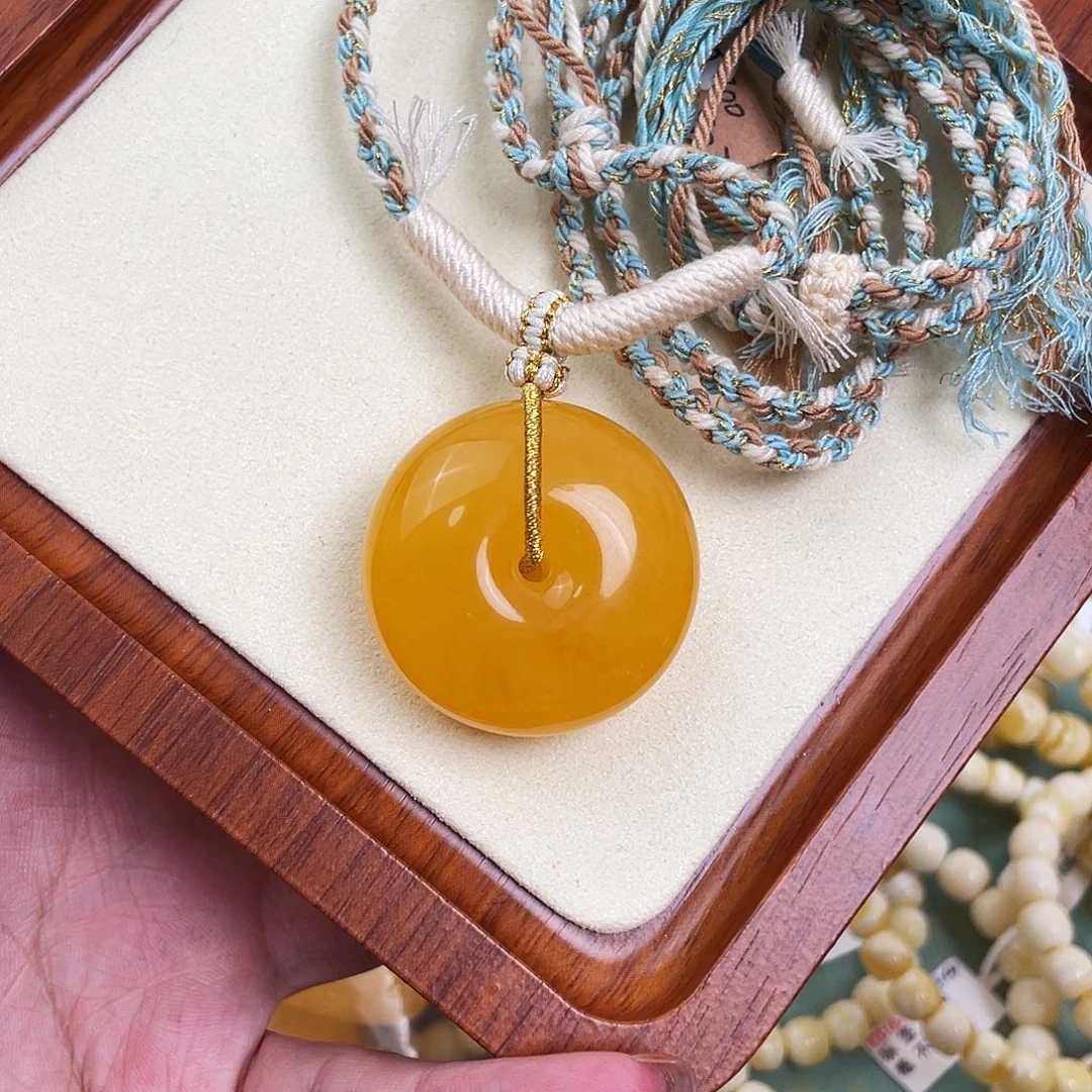 琥珀未镶嵌裸石焦皮料鸡油黄扣子