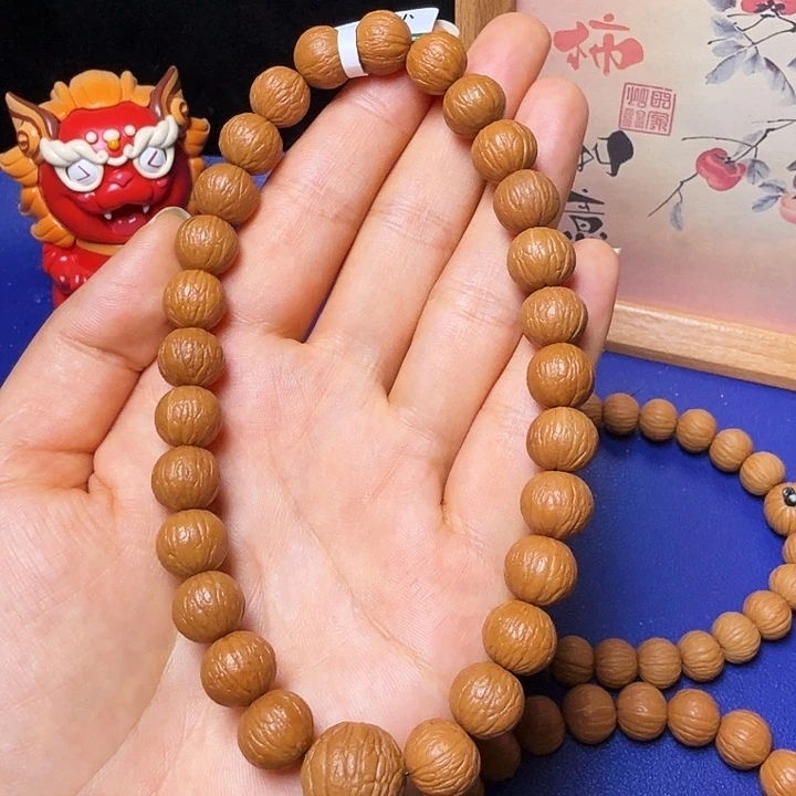 L***_猴头核桃吊坠凤羽