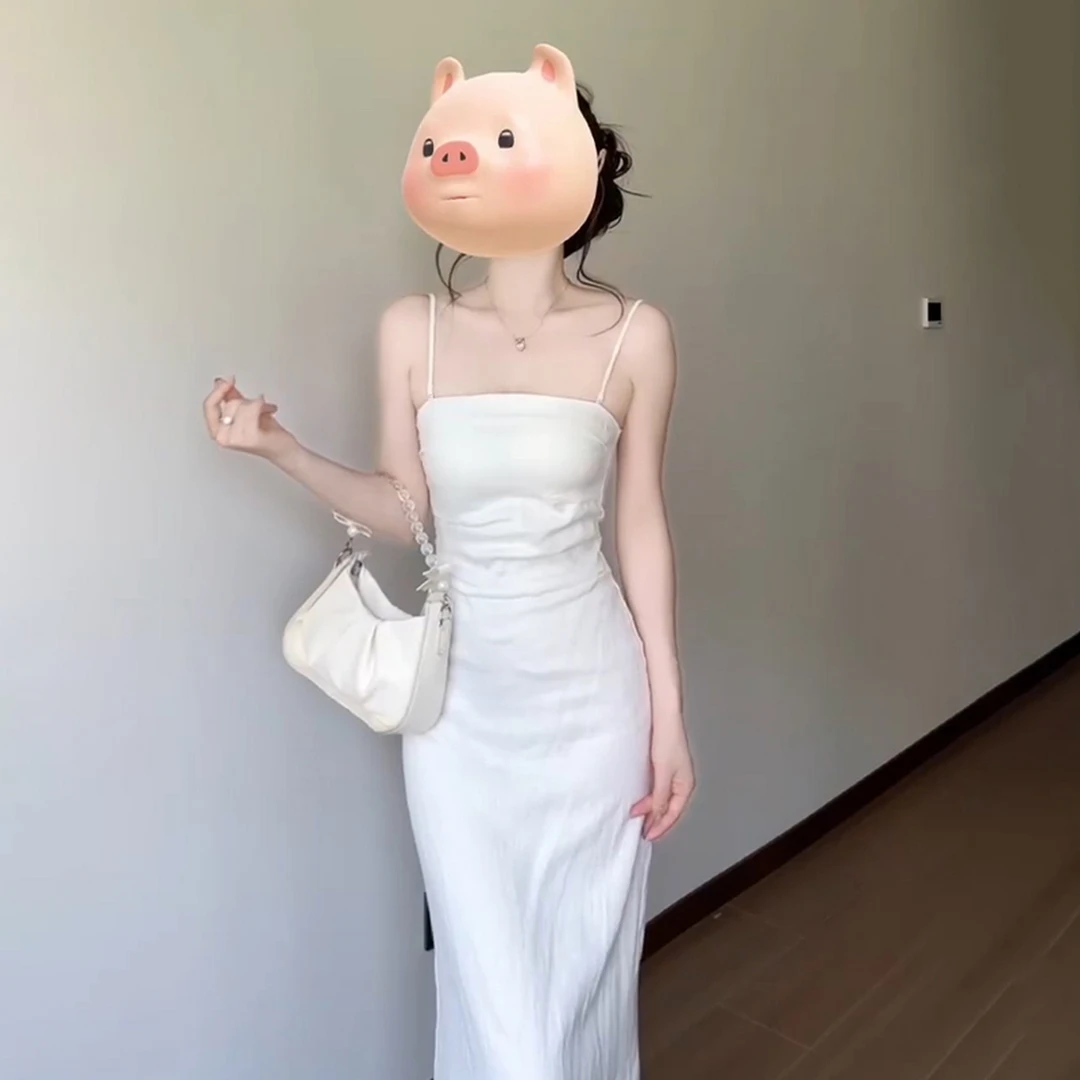 法式度假风白色吊带连衣裙子女夏季2025新款独特漂亮绝美掐腰长裙