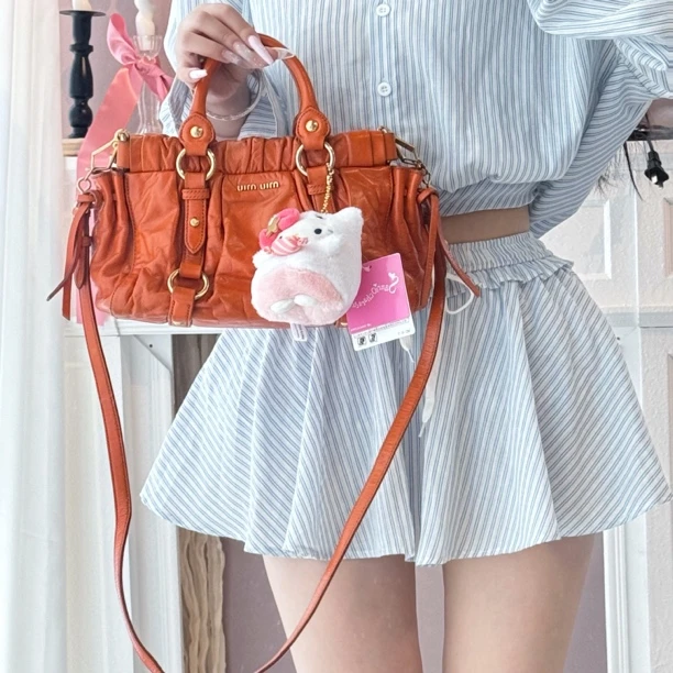 95新 MIU MIU/缪缪 miumiu甜橘色机车手提斜挎包