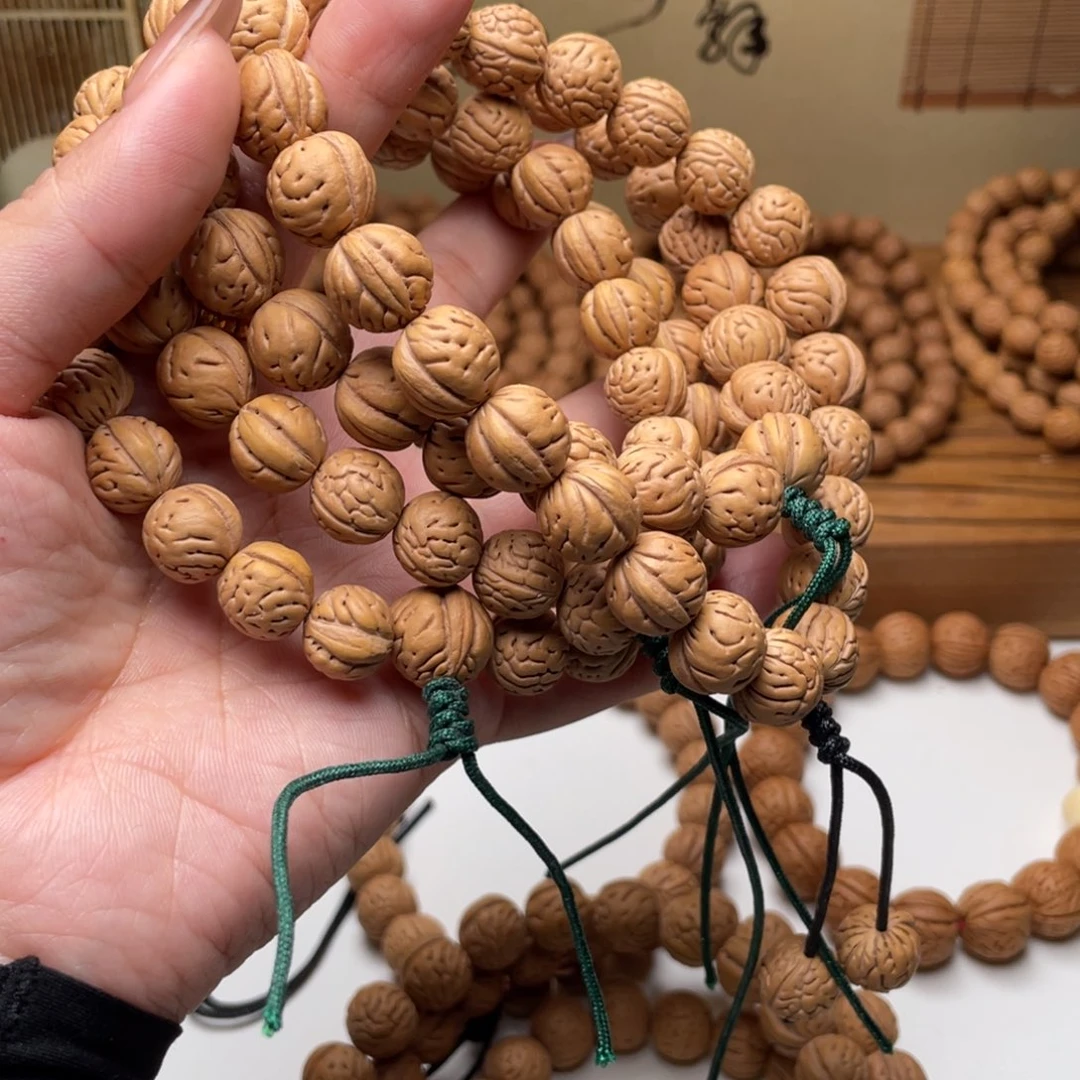 可***可12野生大肠纹桃核手持