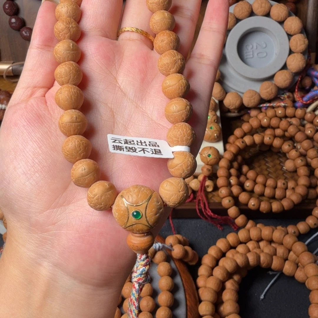 凤眼菩提把件12mm/27颗手持/配麒麟眼三通