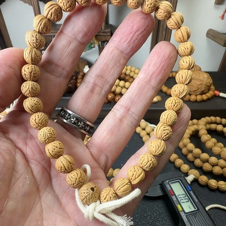 长***赵桃核吊坠桃核手持