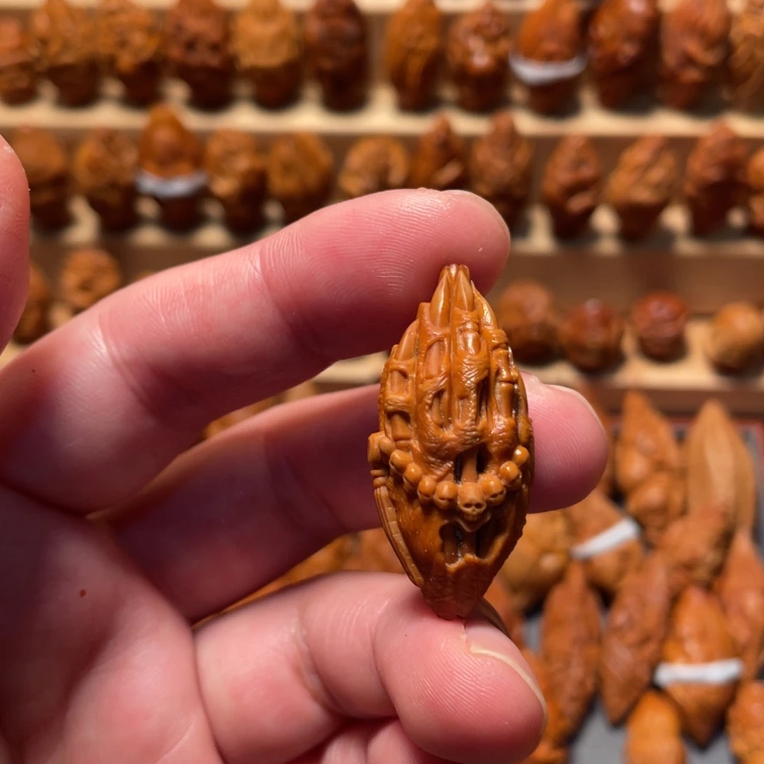 橄榄核吊坠佛魔手