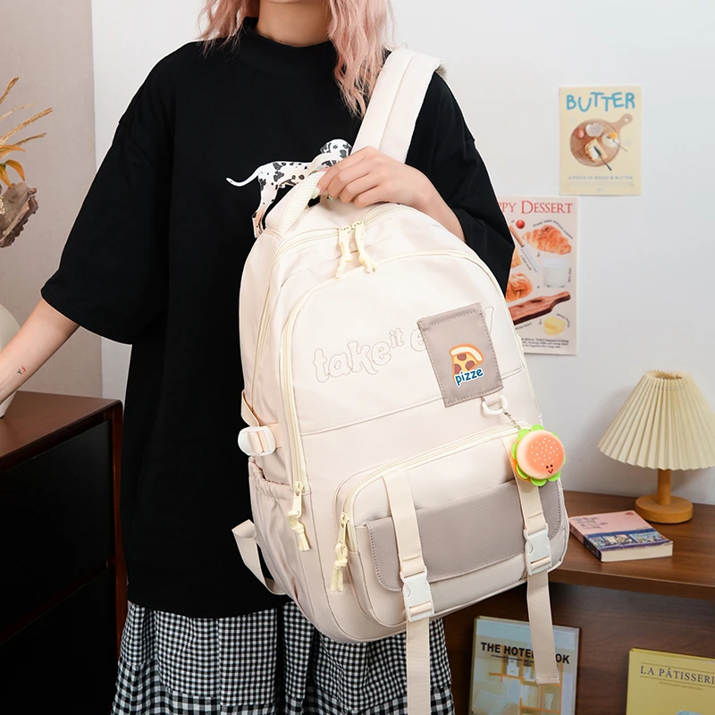 纯色书包初高中大学生男女生时尚大容量潮流轻便简约休闲双肩背包