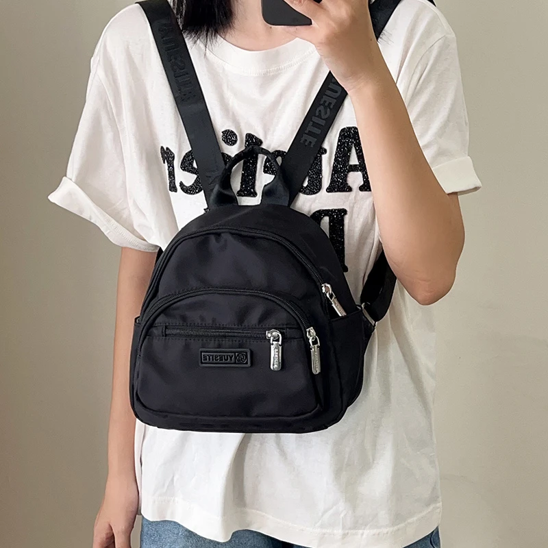 牛津布双肩包女2025新款短途旅游小型背包轻便多口袋女士通勤包包