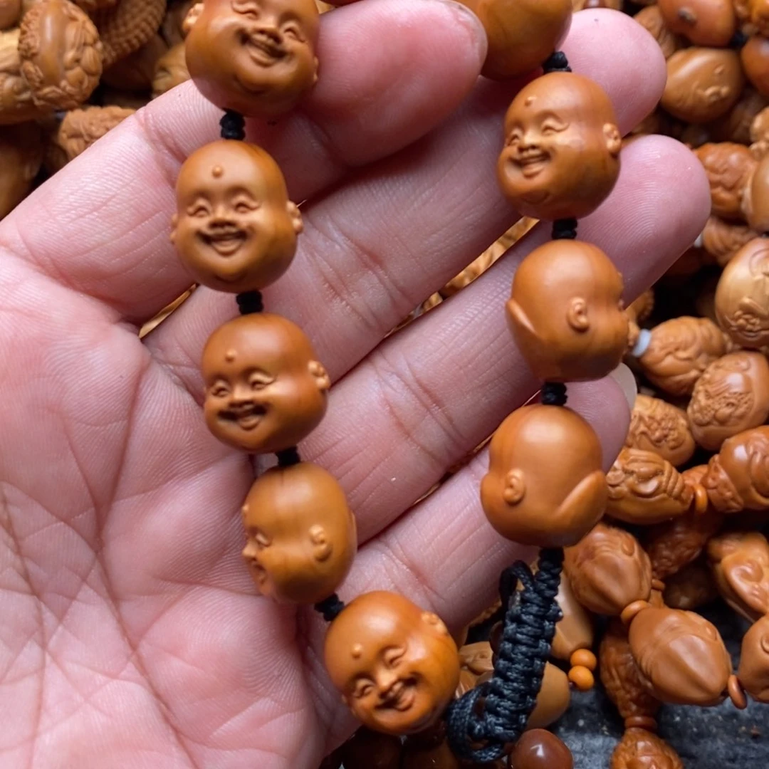 橄榄核手串霸**裁我们的