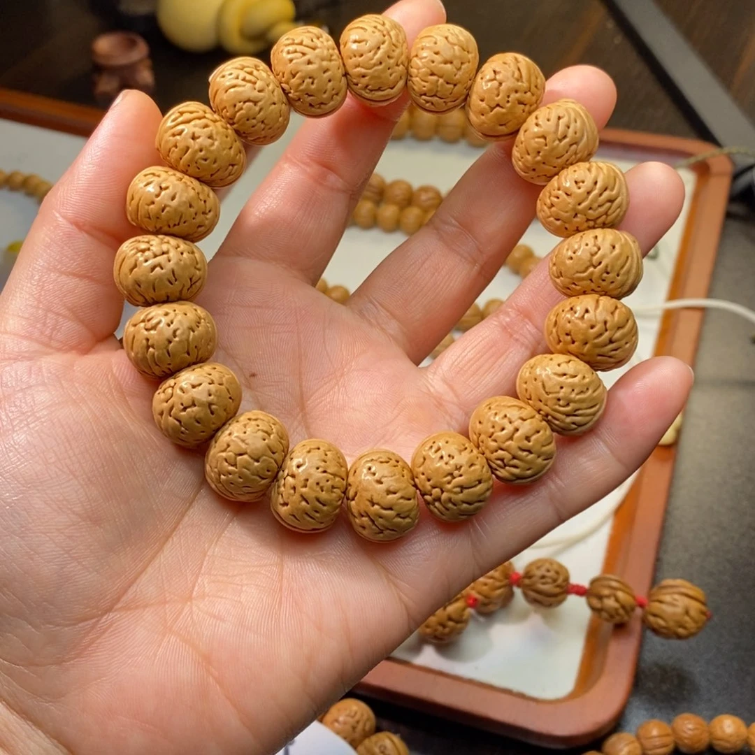 赤***橙吊坠桃核桃核手串纽扣