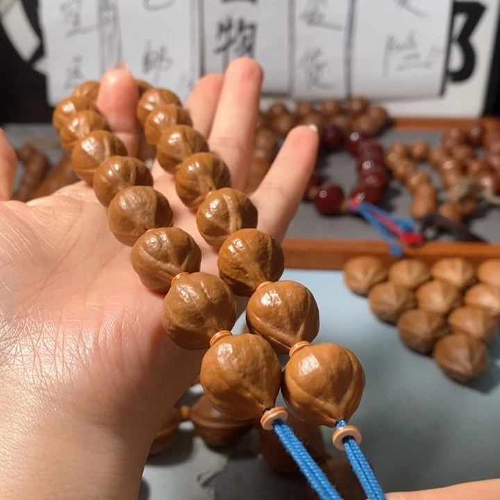 M***》手串橄榄核9161精品蒜头铁核16+2颗