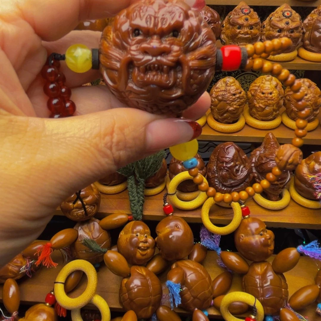 a***a橄榄核吊坠大龙球手把件