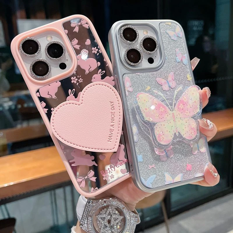 适用苹果系列iPhone16新款手机壳镜面兔子爱心支架全包防摔保护套