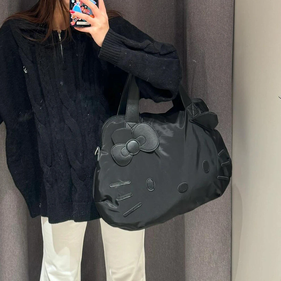 黑色猫咪旅行包包女款日常通勤大容量韩系松弛感手提单肩包健身包