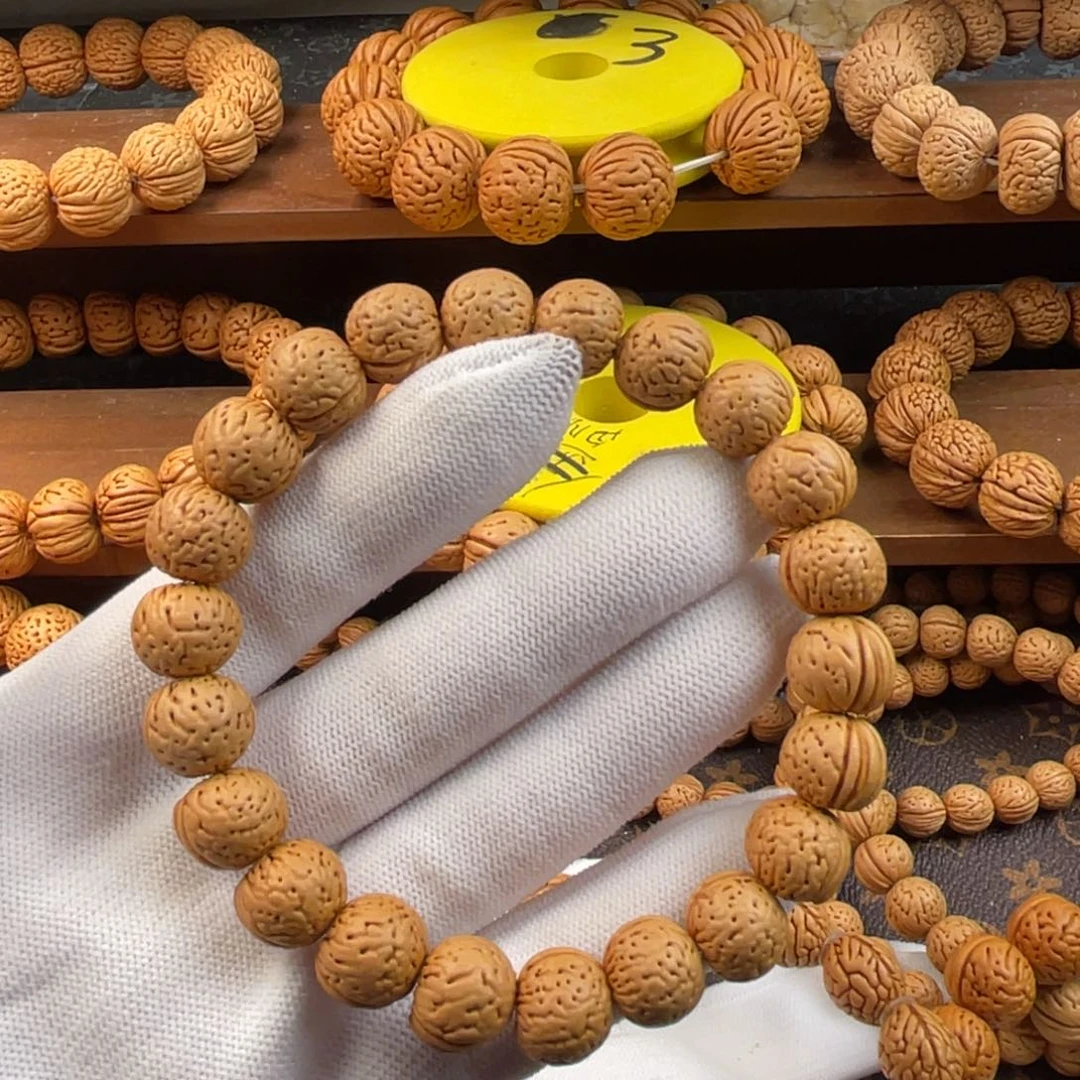 万***春吊坠桃核金丹精品