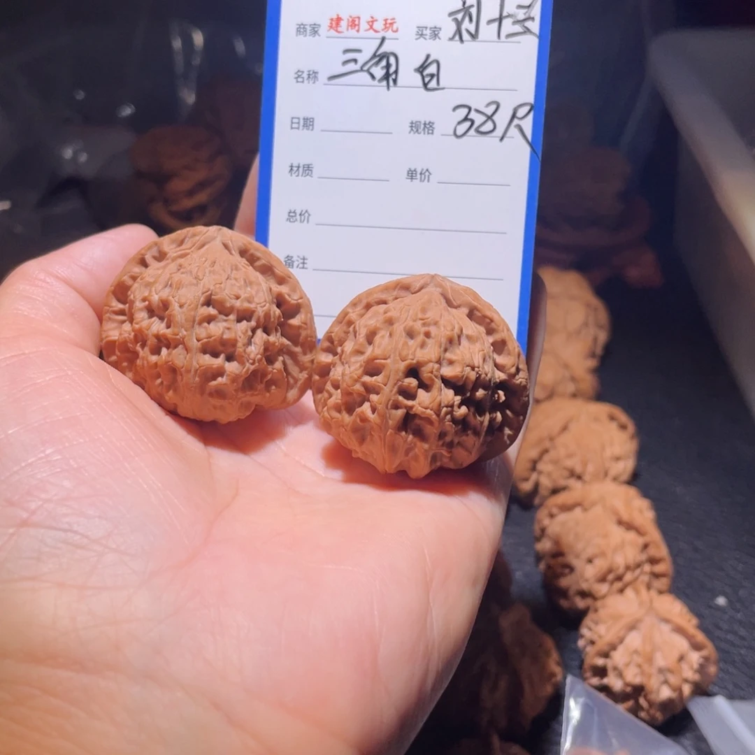 桃核吊坠刘*三38尺三角白