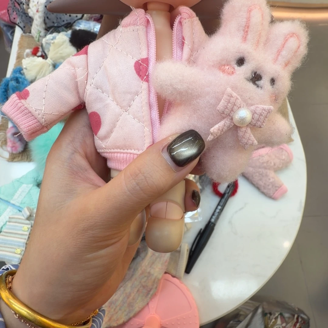 粉色棉衣带玩偶2点照片